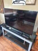 Sony flatscreen TV and TV stand. Remote included