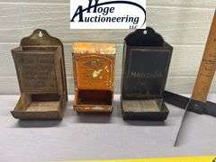 3 tin hanging matchboxes. 1 McCabe - Carruth Funeral Home, 1 R Grocer Delhi Iowa, 1 non-advertising 