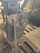 Grease barrel w/pump on 2 wheel cart