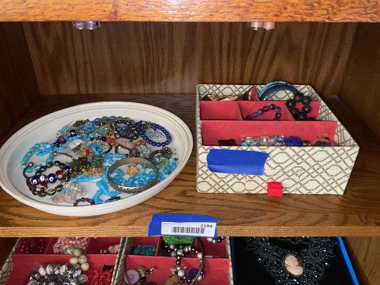 Contents of shelf: costume jewelry