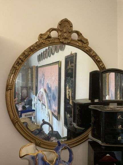 Round gilt framed wall mirror w/ shell crest