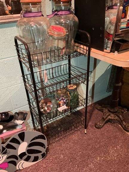 4-tier wire stand and bottles on top shelf - no other contents