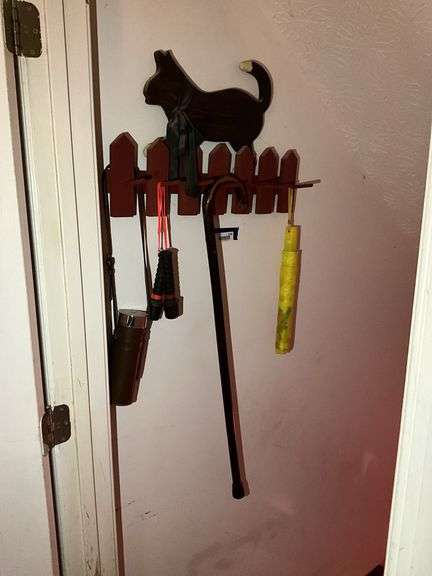 Cat wall plaque w/ hooks and contents: umbrellas, cane