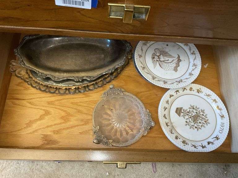 Contents of drawer: Spode Christmas plates, mirrored glass dresser tray, metal mounted glass dish, metal tray, blue/white Christmas plates