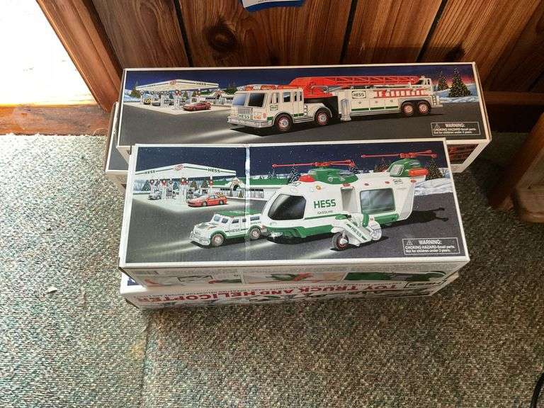 Four Hess trucks in boxes