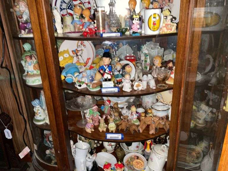 Contents of shelf: figurines, American cruet, fake Nippon cups, plates