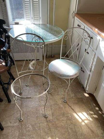 Round glass top metal  bistro table and pair of chairs - note no seat to one chair