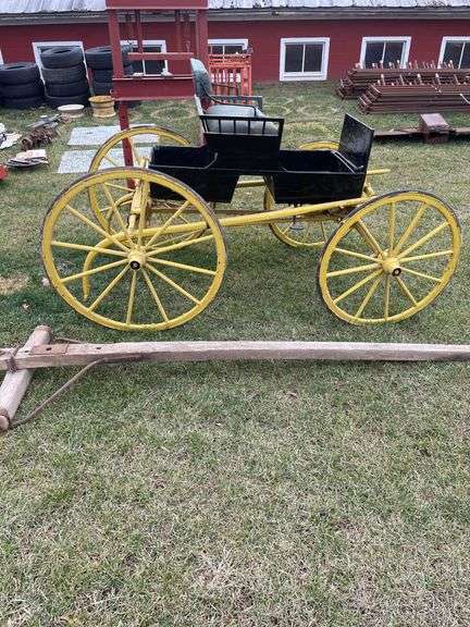 Antique single seat surrey and old wagon shaft