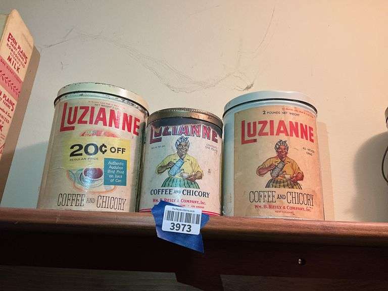 Three Luzianne Coffee advertising tins