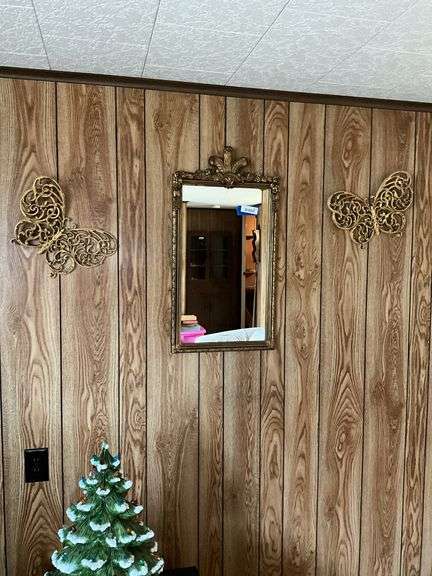 Wall hangings: Gilt framed mirror and butterfly wall plaques