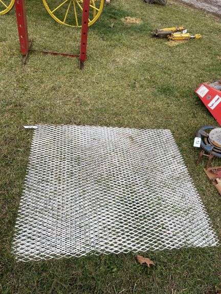 Two pieces of metal grate approximately 40“ x 40“