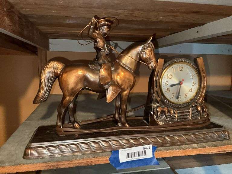 Bronzed metal figural cowboy electric clock