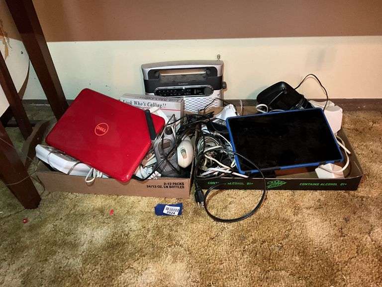 Red Dell laptop, RadioShack portable radio, phones lot, misc