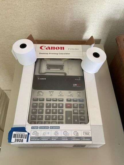 Canon printing calculator in box, with paper rolls