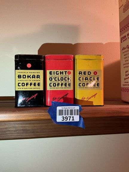 Three advertising coffee tins