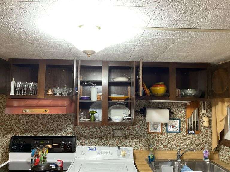 Contents of four cupboards: vintage Tupperware, stemware, Corning, cookware, misc