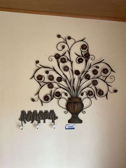 Wall hangings: frog coat hooks, and floral/urn wall plaque