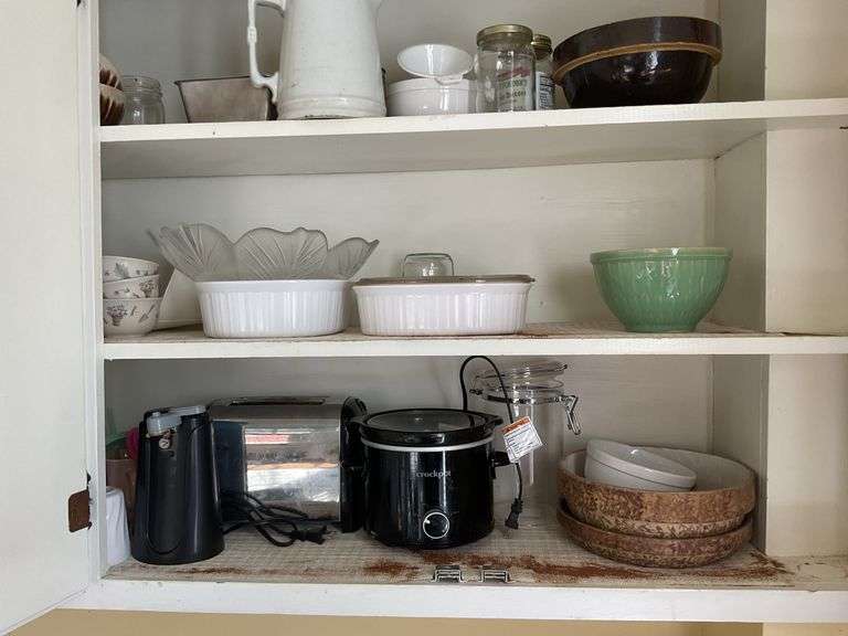 Contents of four cupboards: small appliances, Corning, pottery mixing bowls, dishes, misc