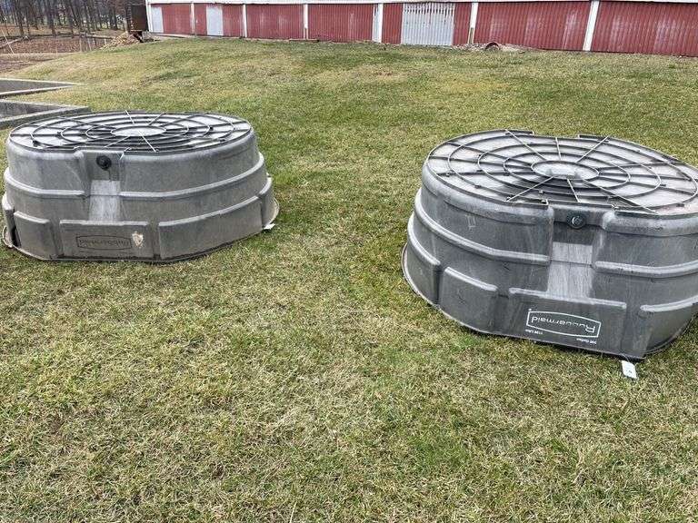 Two large Rubbermaid 300 gallon waterers. One has approximately 10 inch crack and one is damaged badly.