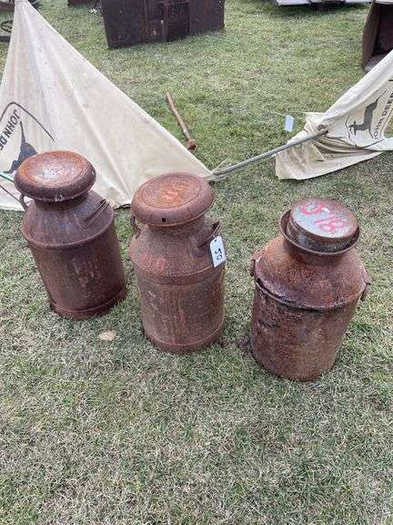 Three milk cans