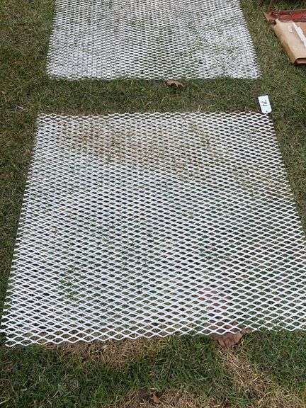Two pieces of metal grate. Approximately 40” x 40”