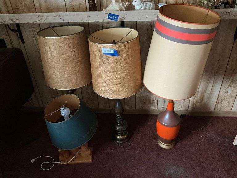 Four mid-century table lamps w/ shades including burnt orange lamp w/ matching shade