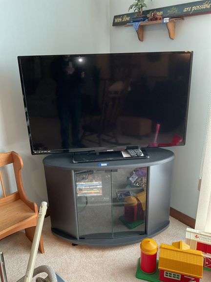 Philips TV w/ remotes, model: 50PFL4901/F7B and TV stand w/ Magnavox DVD player and DVDs