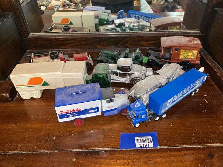 Misc toy trucks including coin bank, cologne bottle & Greencastle water tanker