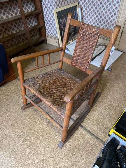 Turned rocking chair w/ woven seat and back panel