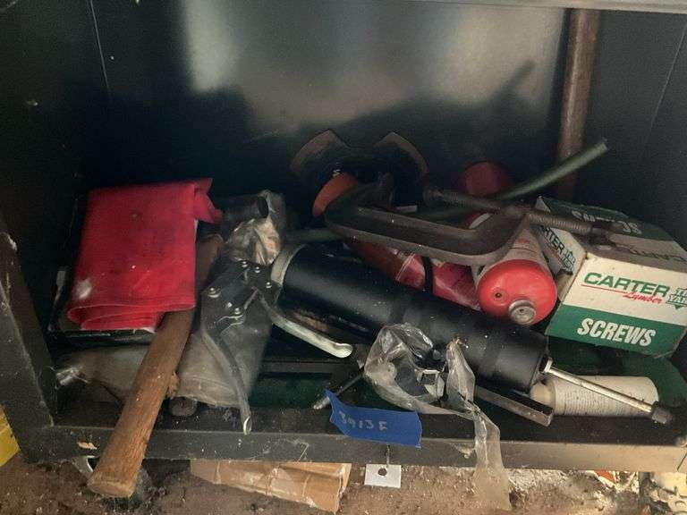 Contents of drawer to include grease gun, screws and more