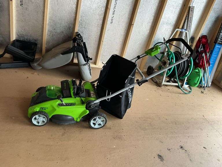 Greenworks battery power lawn mower, includes battery and charger.