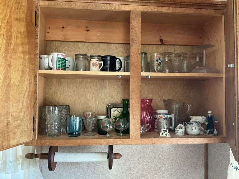 Contents of cupboard: mugs, stemware, glasses, Japanese porcelain creamer, misc