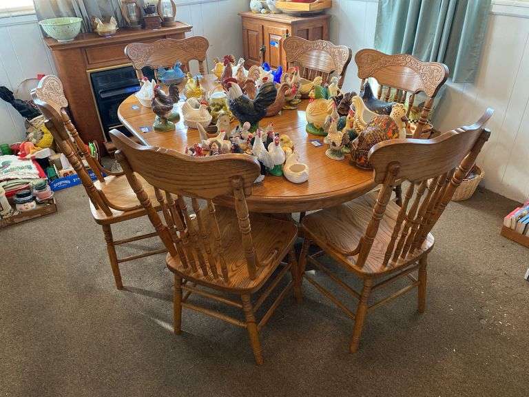 Oak pedestal dining table w/ six chairs, two leaves, no contents 42x66x30
