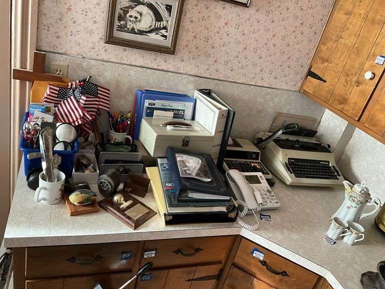 Office supply lot including: electric typewriter, paper cutter, telephone, calculator, pencil sharpener, and misc