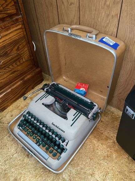 Smith-Corona portable typewriter w/ case & two ribbons