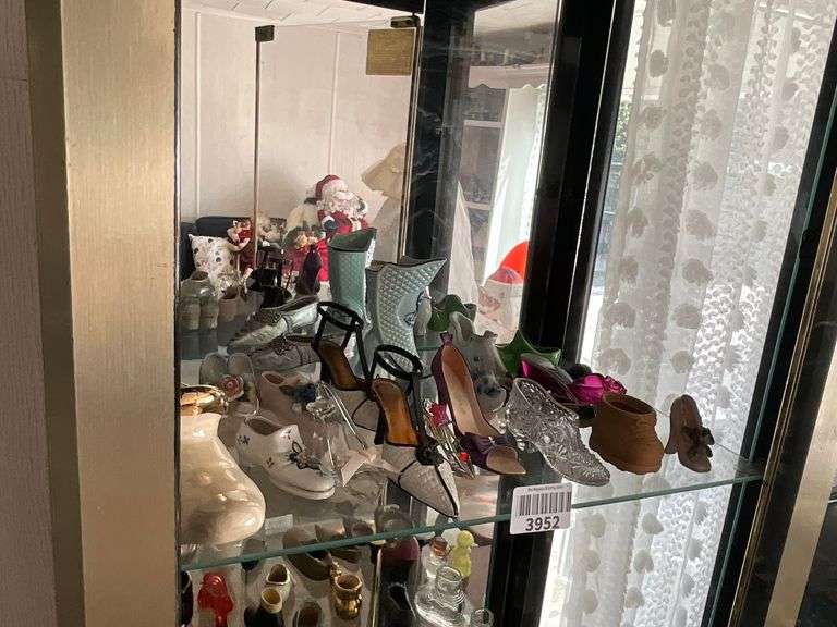 Contents of shelf: shoe collection including glass, ceramic, porcelain