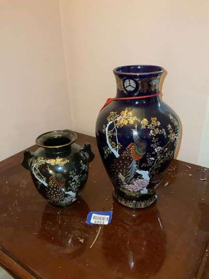 Two Asian vases w/ peacock decor, one has black ground, one cobalt blue