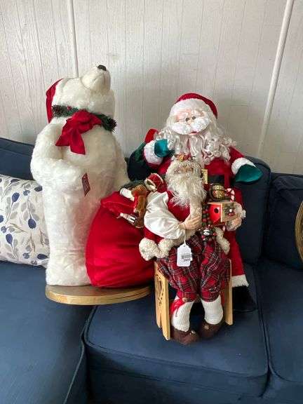 Plush polar bear and two dressed Santa figures