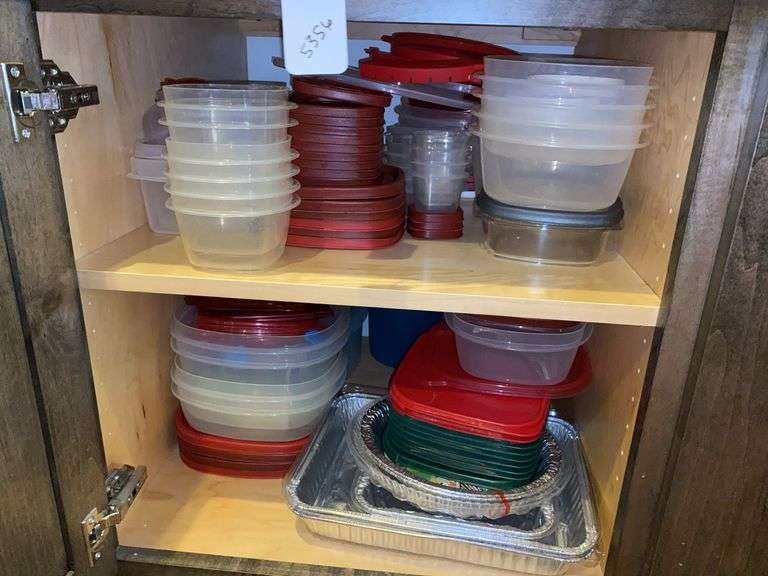 Contents of cupboard: plastic storage containers, foil pans