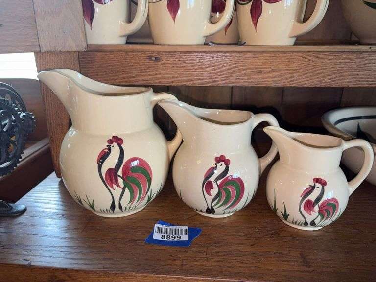 Three WATT ware pottery rooster pattern graduated pitchers