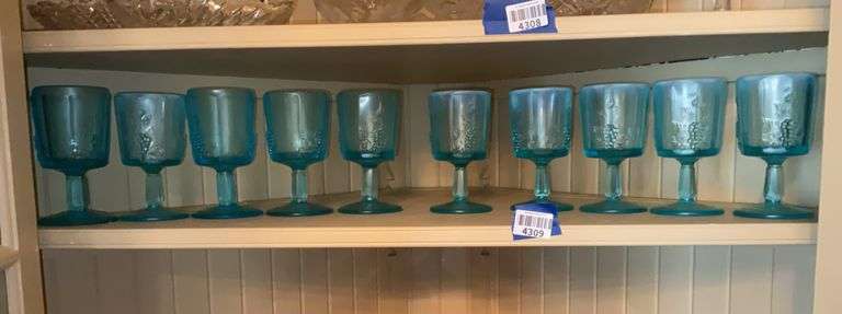 Contents of shelf: ten blue Paneled Grape goblets, some are oplaescent