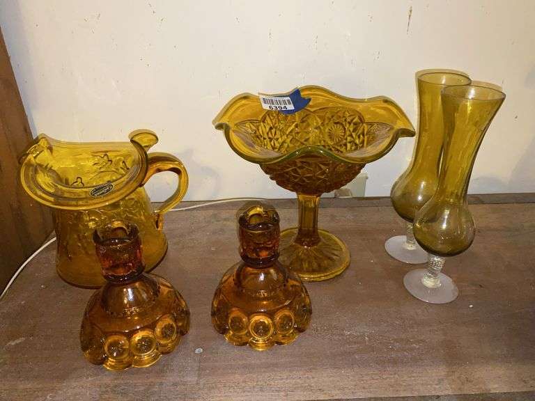 Vintage amber glassware including: Kanawha pitcher, Moon & Star candleholders, pedestal dish, bud vases