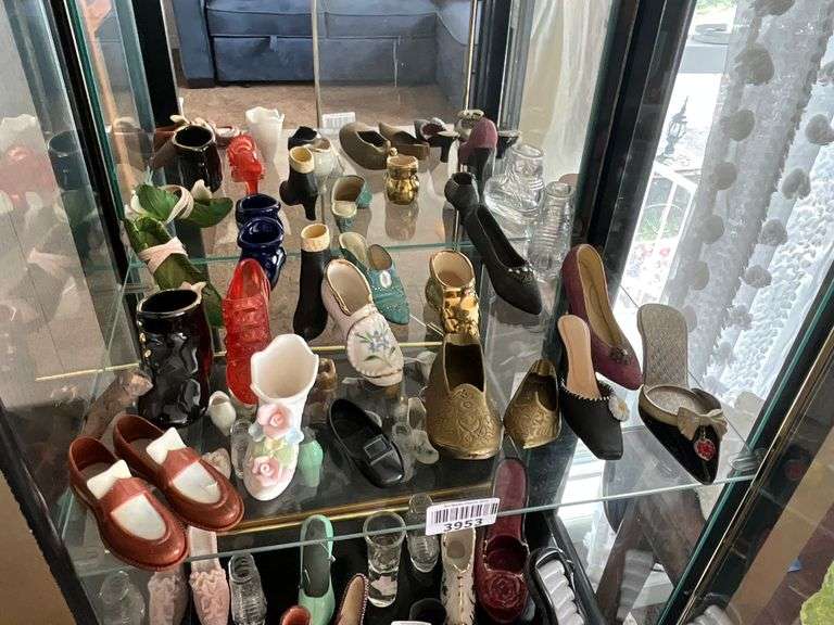 Contents of shelf: shoes in brass, ceramic, plastic