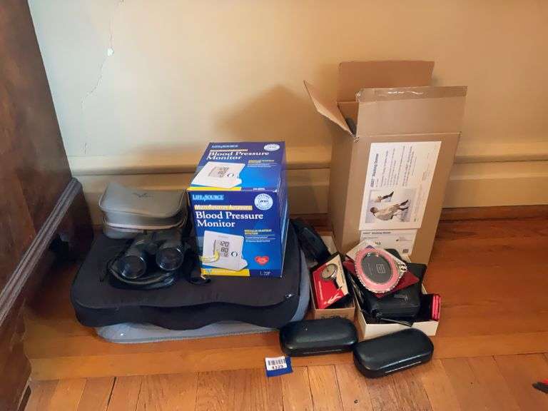 Binoculars, digital blood pressure monitor, pedometer, stocking donner, misc