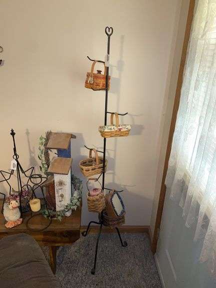 Longaberger baskets collection on wrought metal display stand