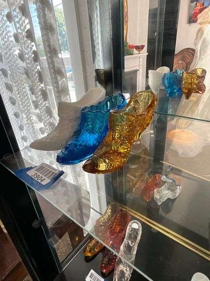 Three Fenton glass shoes: milk glass, blue, amber