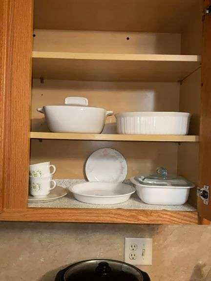 Contents of two shelves: Corning/Corelle baking dishes, pie plate, cups