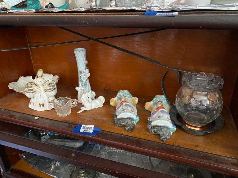 Contents of shelf: leaf dish, vintage lipstick holder figurine, unicorn figurines, pair porcelain wall vases, engraved glass vase, misc