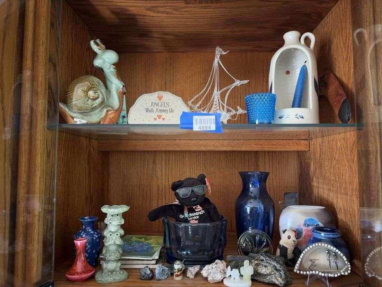 Contents of two shelves: lampwork ship, figurines, vases, decor items, Goodwrench Teddy bear