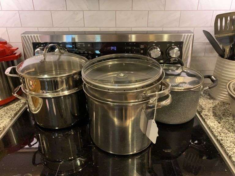 Two steamer pots, strainer pot